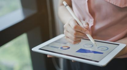 Person using iPad to manage their pension